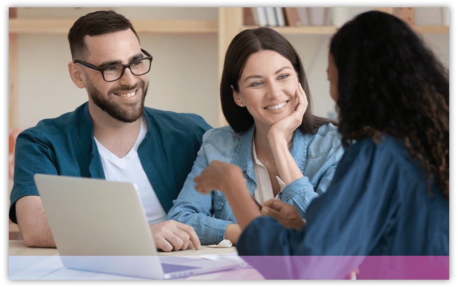 Couple speaking with insurance agent at their dining table