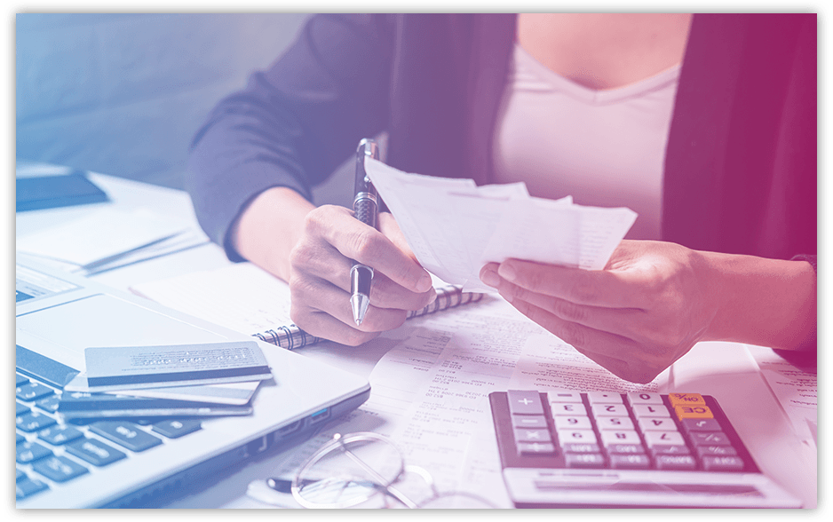 A woman sorting through bills and fines