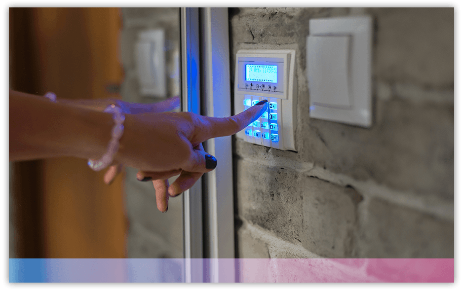 A woman's hand pushing a button on a home security keypad